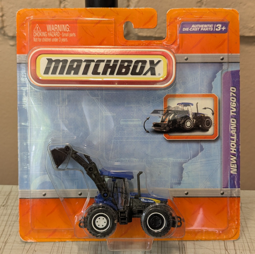 Trattore Matchbox New Holland TV6070 ricambi reali funzionanti NUOVO blu - Foto 1 di 6