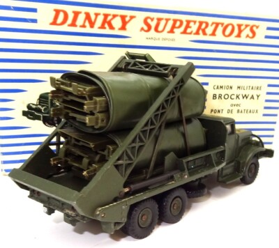 A French Dinky Toys Military Truck with a Brockway bridge load (884). In olive green, complete w