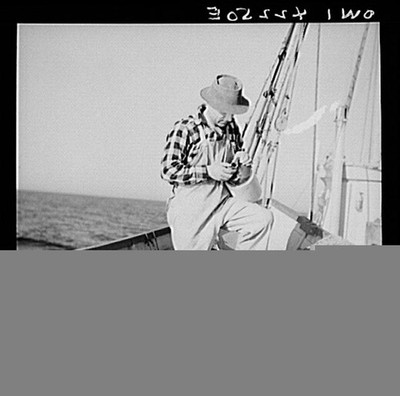 On board a fishing vessel out from Gloucester, Massachusetts. A dory fisherman
