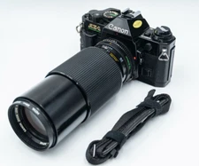 Black Canon AE-1 Program SLR Camera + Canon FD 70-210mm F/4 Telephoto Zoom Lens