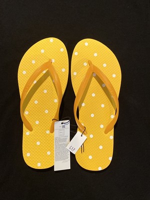 yellow dot flip flops