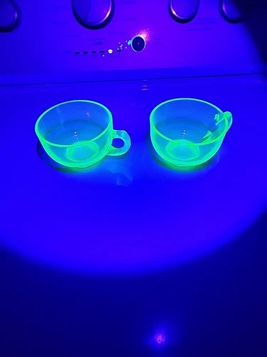 vintage green depression glass teacups, likely uranium glass,