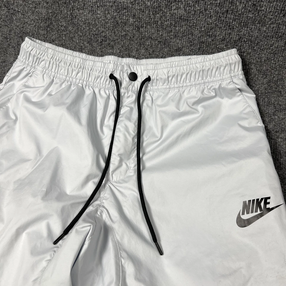 Pantalones Nike Para Hombre Medianos Plateados Reflectantes Joggers Forrados Cremallera Bolsillos Cordón Foto 3 de 4