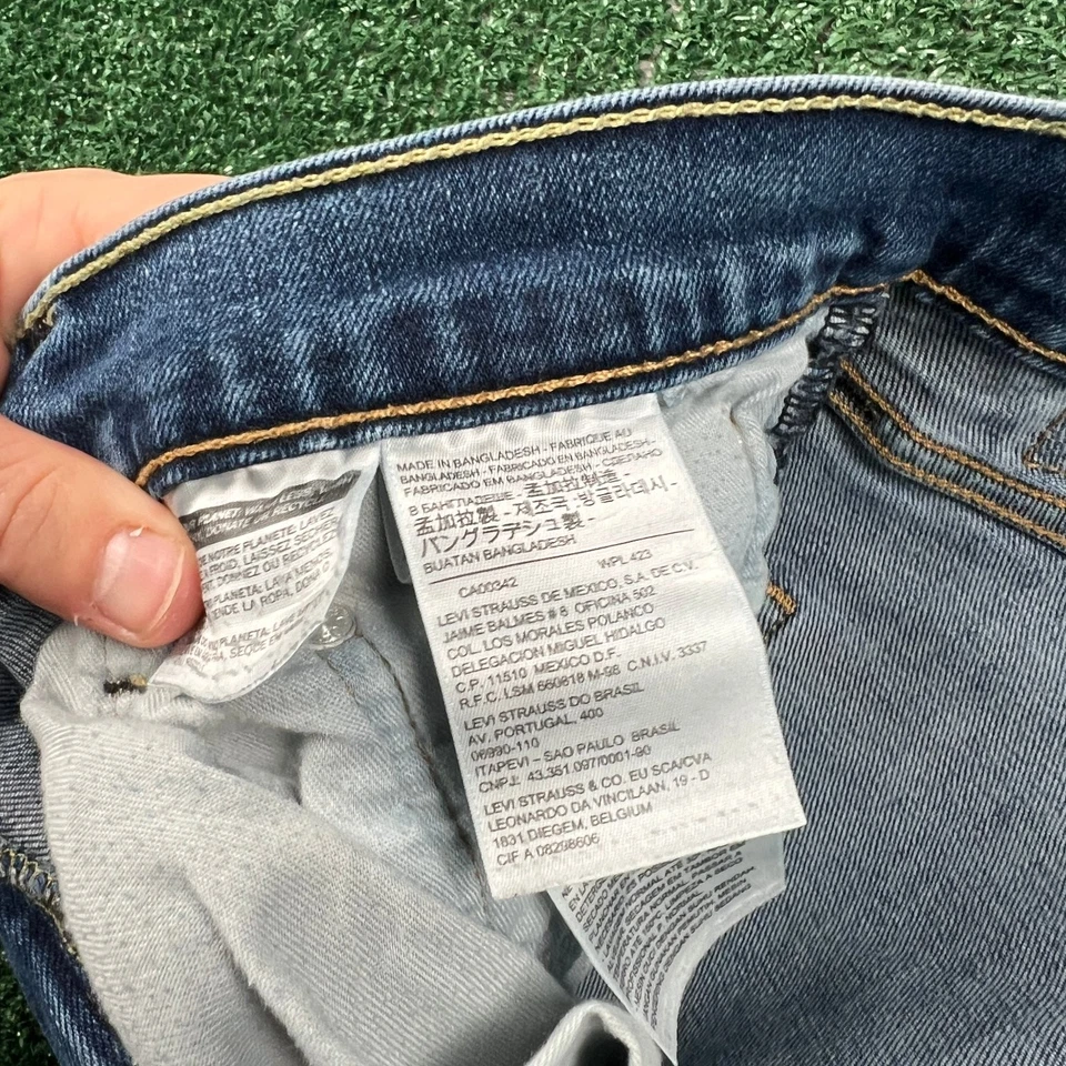 Jeans Levi's 513 ajustados rectos con cremallera lengüeta roja para hombre 33x30" azul lavado medio Foto 2 de 4