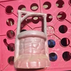 vintage Niloak Pottery wishing well planter in a dusty rose or pink glaze.