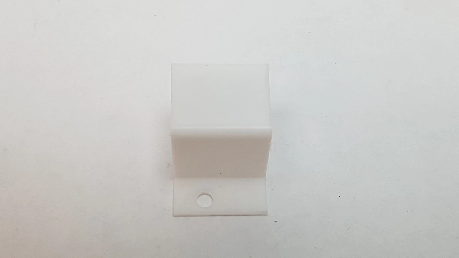 Lumenis anode cover from above, showing the channel and a flange hole