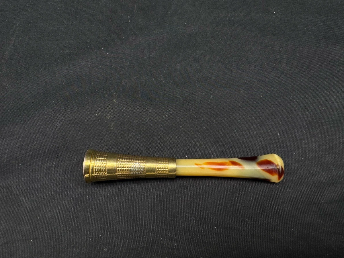 1960s cigarette holder 1960s. A lady smoking a cigarette using a cigarette holder Stock Photo