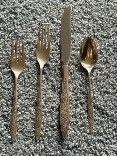 Sterling silver Flatware. Four-piece Place Setting by Wallace. Spanish Lace.