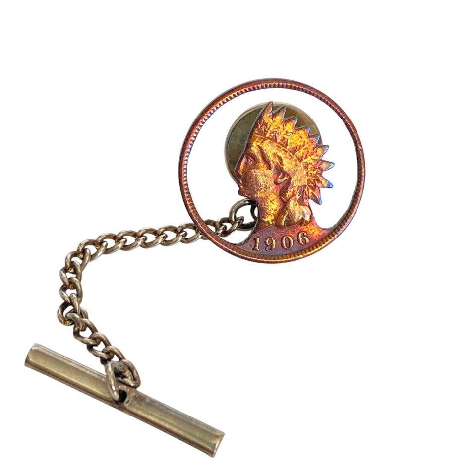 A 100+ year old 1906 Indian Head penny — hand-cut into a one-of-a-kind tie tack — wearable history you literally can't replicate.