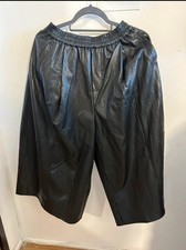 Black ankle length leather trousers