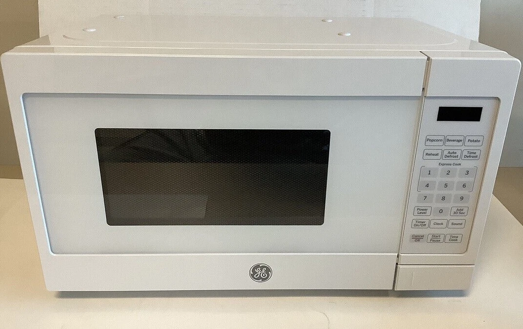 GE 0.7 cu. ft. Small Countertop Microwave in White for Sale in