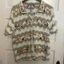 Tiara international crochet sweater with embroidery over it. Size L