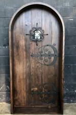 Rustic reclaimed lumber arch top door solid wood storybook iron Castle speakeasy