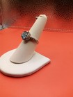 Sterling Silver 925 Ring With An Oval 9x7 mm Swiss Blue Topaz Surrounded By Czs  — photo 2