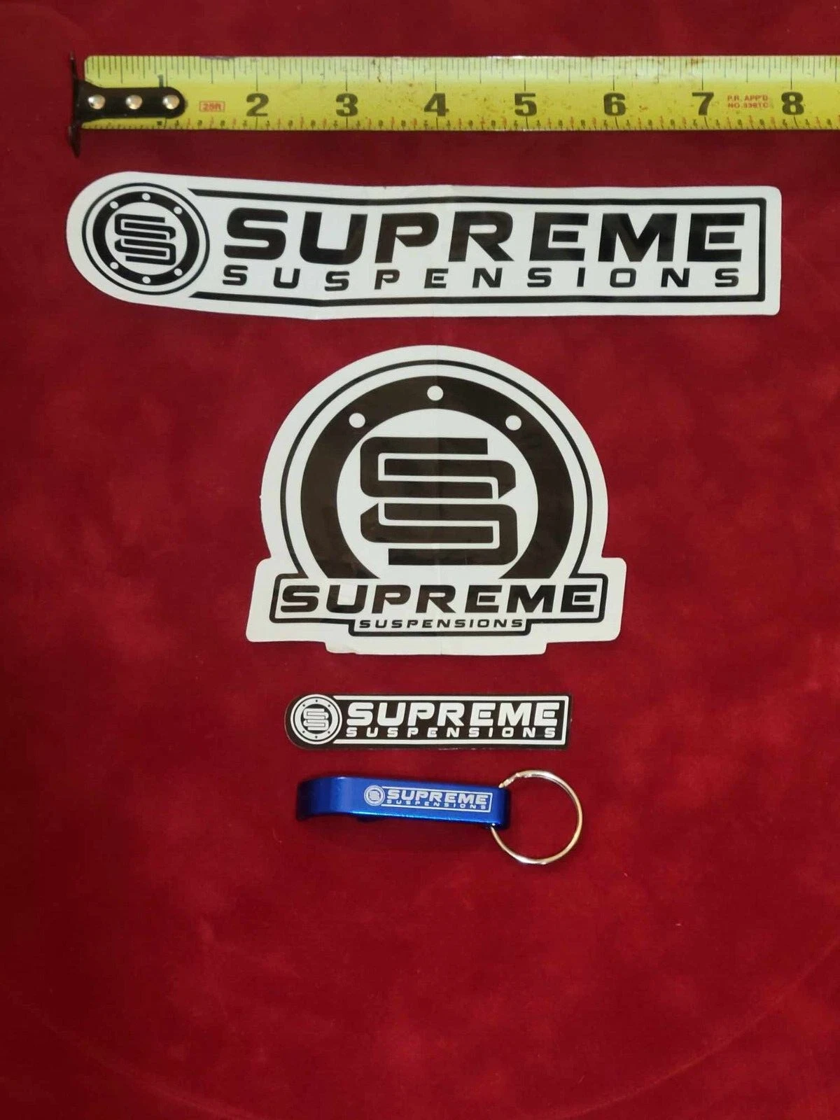 Pack autocollant porte clés ouvre bouteille et décalcomanie Supreme Suspensions