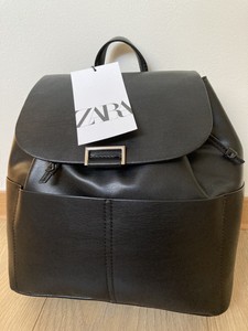 black backpack with pockets