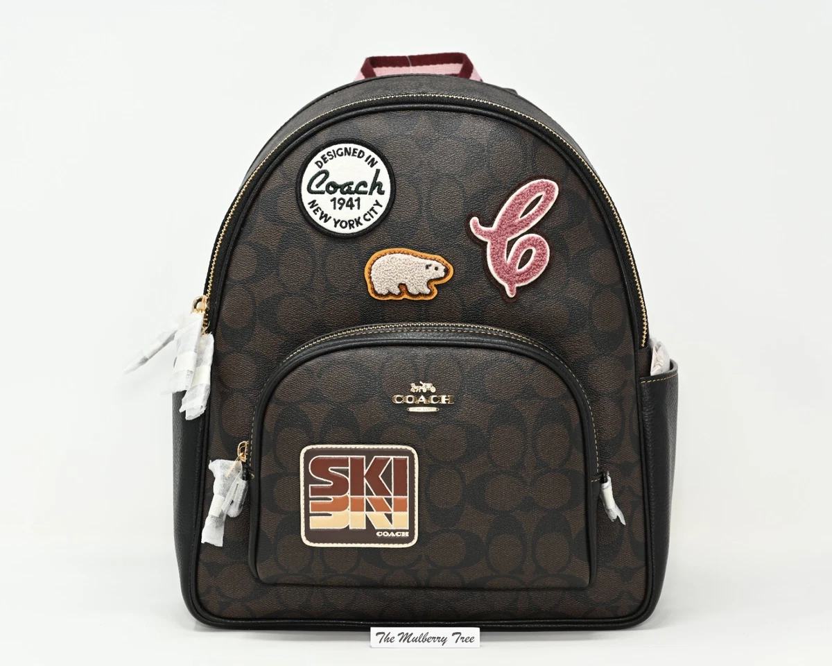 Disney x coach court backpack in signature canvas with patches Clearance