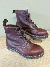 Classic Dr Martens 1460 boots in iconic cherry red / oxblood leather.