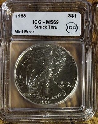1988 American Silver Eagle Mint Error Struck Thru MS69 ICG