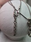 2This is a Brighton cross pendant and chain lanyard, often used as an ID badge — photo 3