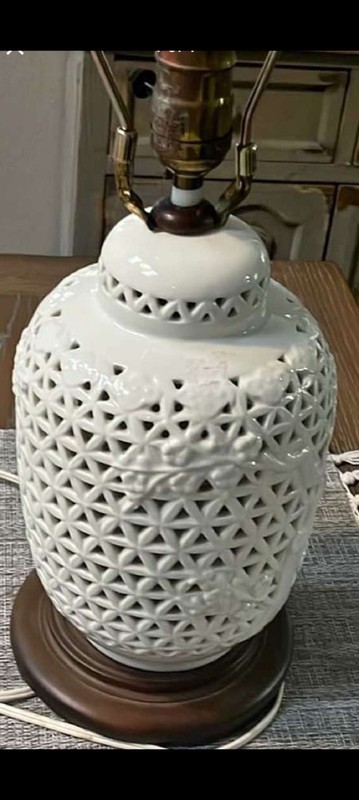 Porcelain table lamp with reticulated blanc de chine body 