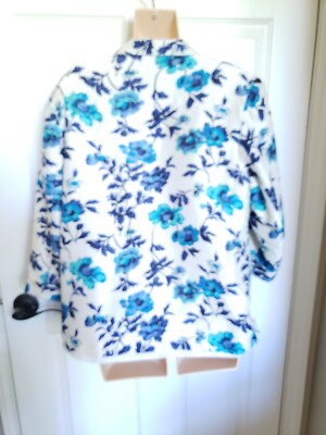 Premium AI Image | a woman with a denim jacket and a floral print shirt