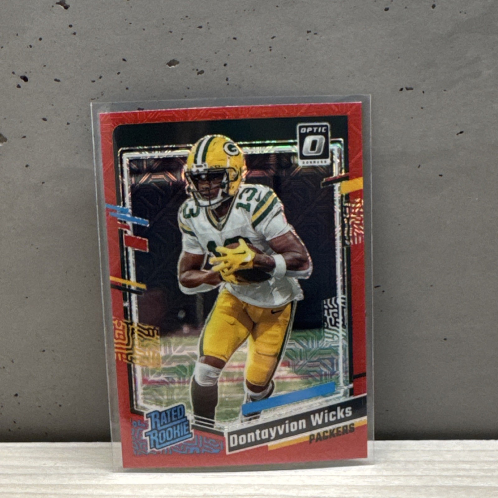 Panini 2023 Donruss Optic Dontayvion Wicks Red Mojo Prizm Rated Rookie #249