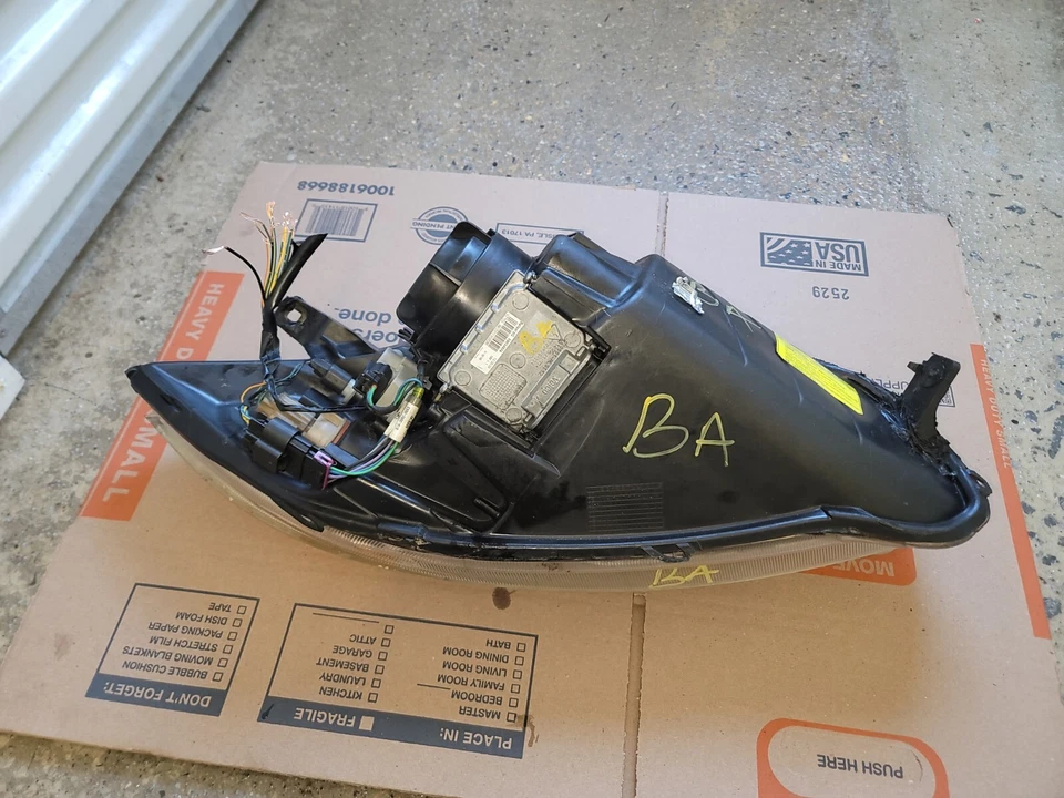 Conjunto de faros de xenón HID lado izquierdo/del conductor Mitsubishi Eclipse 2009-2012 OEM Foto 2 de 4