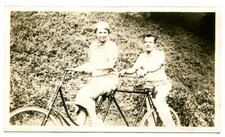 TANDEM BICYCLE, BICYCLE BUILT FOR TWO. HAPPY COUPLE RIDING. 1920-40s.