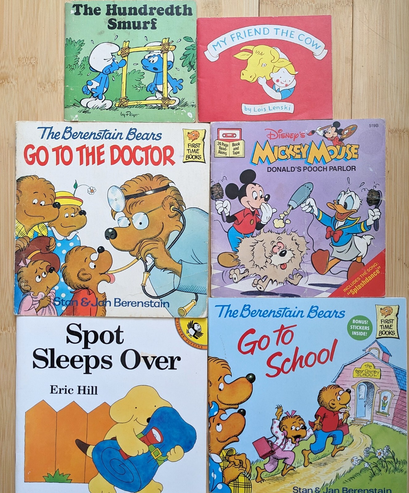 6 kids' books: Berenstain Bears, Mickey Mouse, Smurfs, Spot, My Friend the Cow