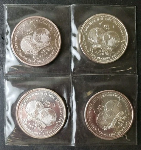 Four 1986 1oz Silver World Trade Unit Rounds in Plastic