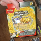 Box of mixed sealed pokemon items in multiple varieties and sets. — photo 7