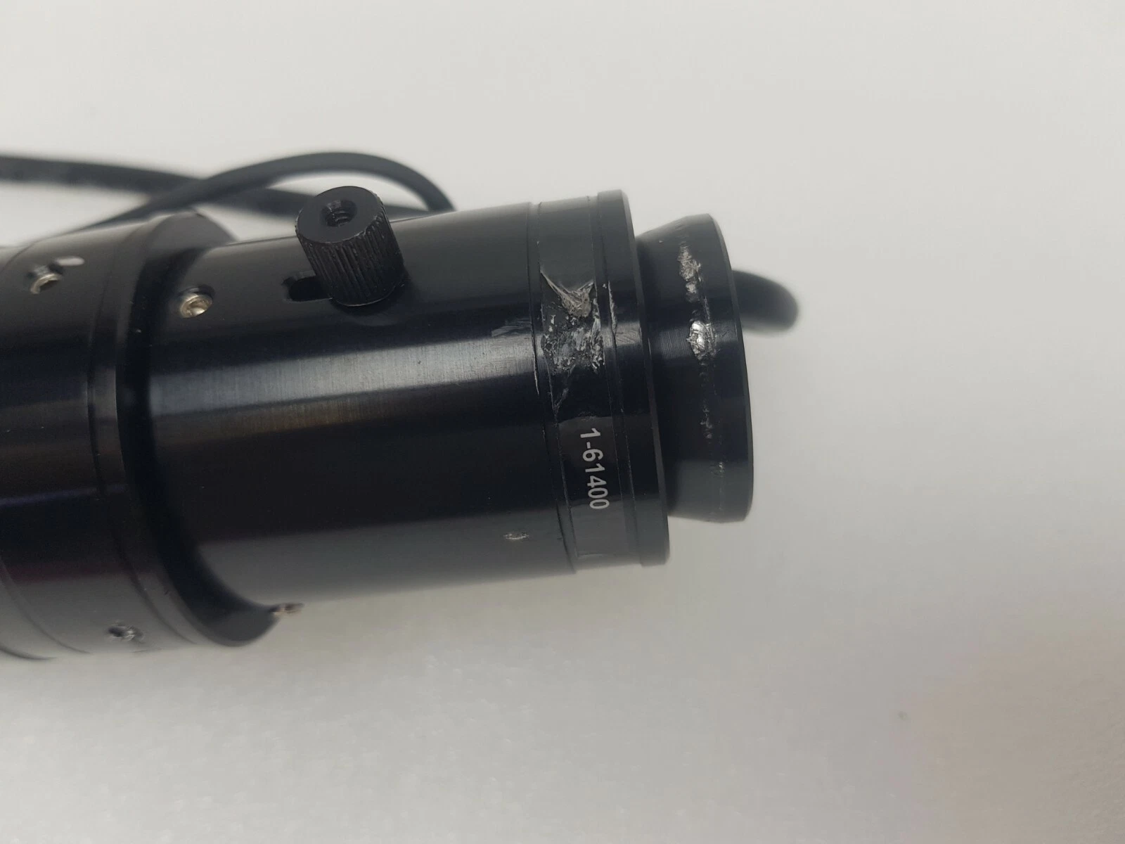 1-61400 marking on the Navitar mini adapter with scuffed label area