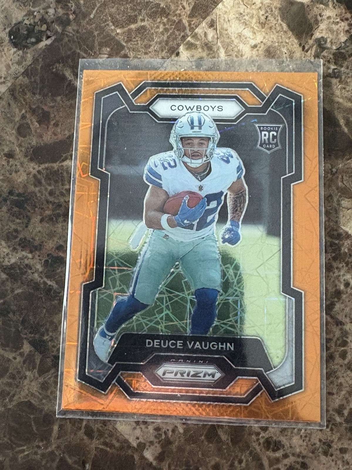2023 Panini Prizm Deuce Vaughn #324 Orange Lazer Prizm Rookie RC Dallas Cowboys