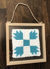 Beautiful vintage crocheted quilt square in floating frame, teal