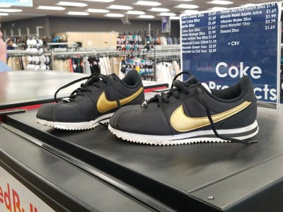 nike black and gold cortez trainers
