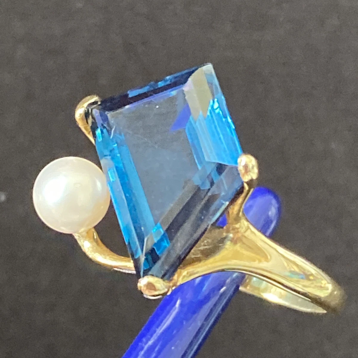 Blue topaz and store pearl ring