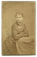 PRETTY WOMAN WEARING CRUCIFIX, EARRINGS AND PLEATED SLEEVED DRESS. CDV. 