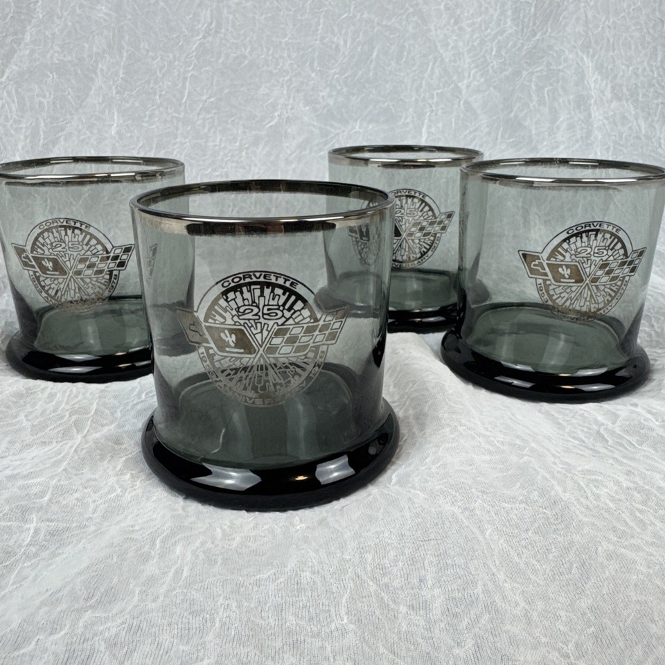 A set of four lowball glasses commemorating the Corvette's 25th anniversary in 1978 — the kind of thing a car guy would actually display, not just drink from.