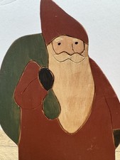 Wooden folk art Santa Claus decoration hand-painted and carved primitive style