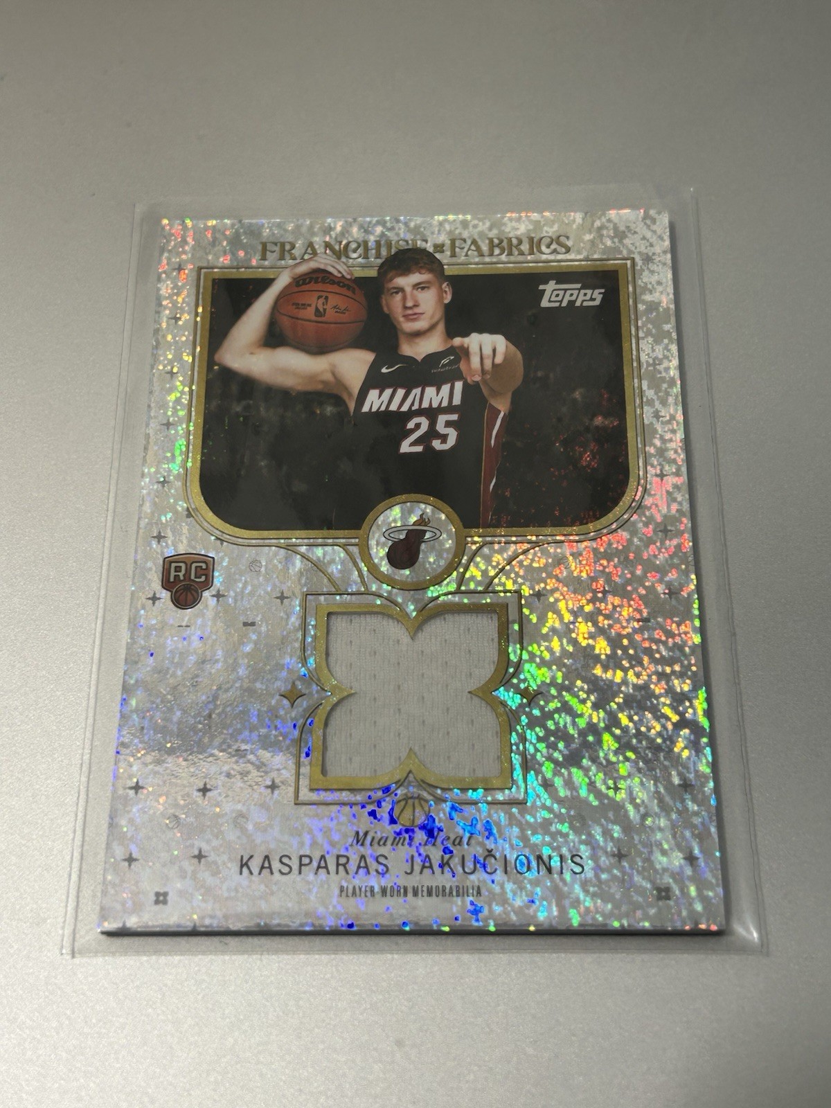 2025-26 Topps - Franchise Fabrics Kasparas Jakucionis #FF-KJ (MEM) Foil Heat Rc