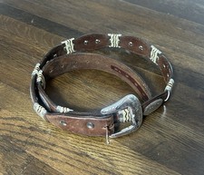 brown leather western belt features silver-toned concho medallions