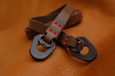 C.K Mike handcrafted slim camera strap With BumperI Horween Chromexel Leather.