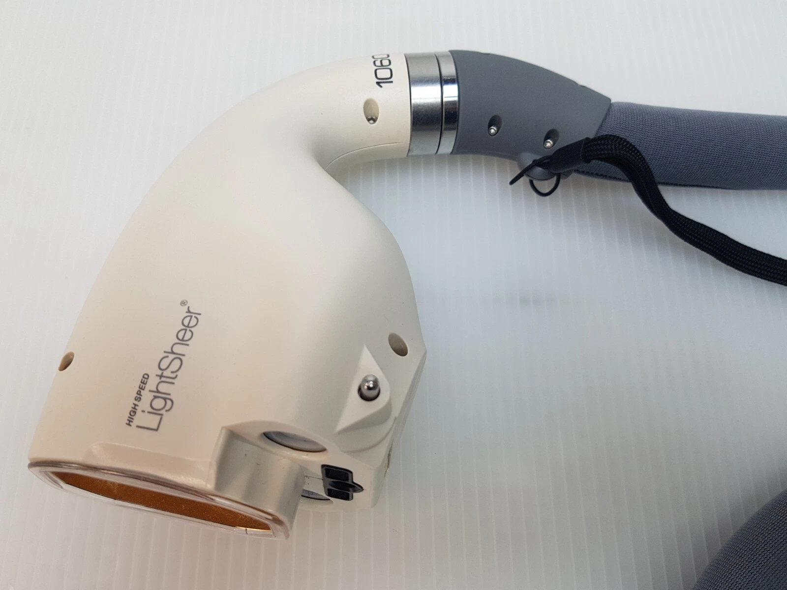 HIGH SPEED LightSheer handpiece head marked 1060, side view