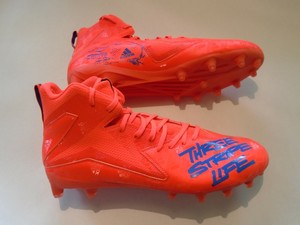 orange adidas football cleats