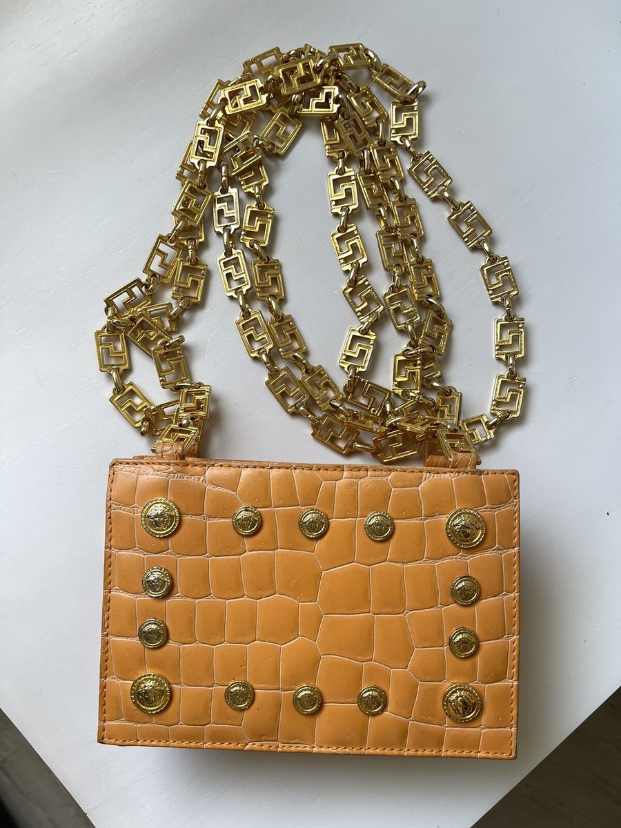 GIANNI VERSACE Orange shoulder bag w/ iconic Chain. F/W 1992