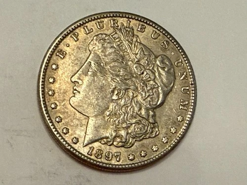 1897-S Morgan U.S. silver dollar. Choice AU, light gold tone. #rd1