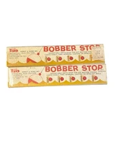 2- Fin division of Fred Arbogast Bobber Stops in Original Packaging Vtg NOS new