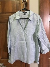This is a sky blue Tahari 100% linen 3/4-sleeve tunic top