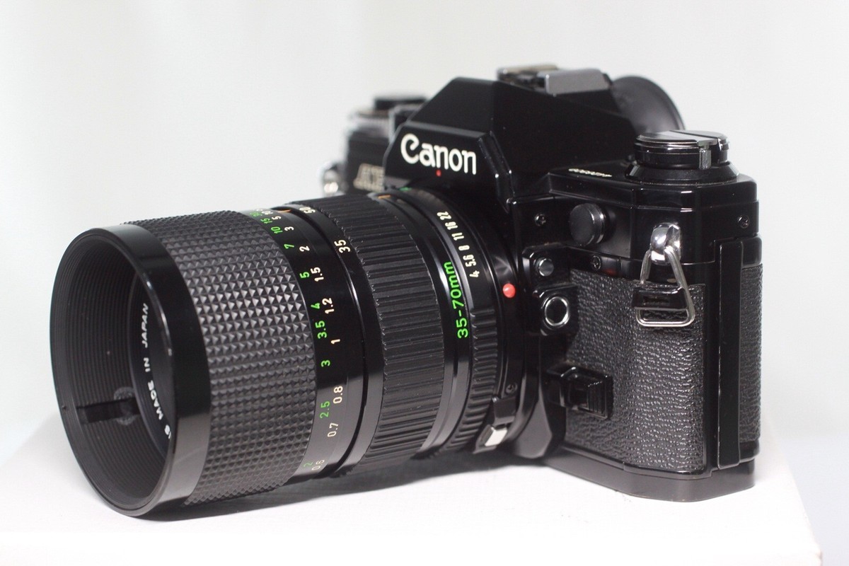 Canon AE-1 35mm SLR Film Camera + New FD 35-70mm F/4 Zoom Canon AE-1 35mm SLR Film Camera + New FD 35-70mm F/4 Zoom
